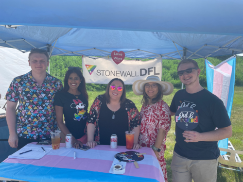 volunteers at the Stonewall DFL booth at Hastings Pride June 3, 2023